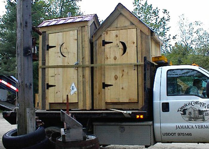 Outhouse being transported by JCS, a local Vermont shed company.