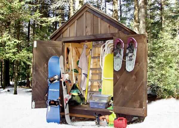 Custom 6x4 Utility Shed being used to store winter sports equipment and gardening tools