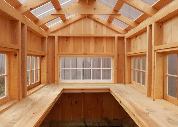 6x8 Greenhouse with built in workbench, clearpoly roof and lots of barn sash windows that hinge out. It is a good idea to clean it out as a winter greenhouse maintenance step. 