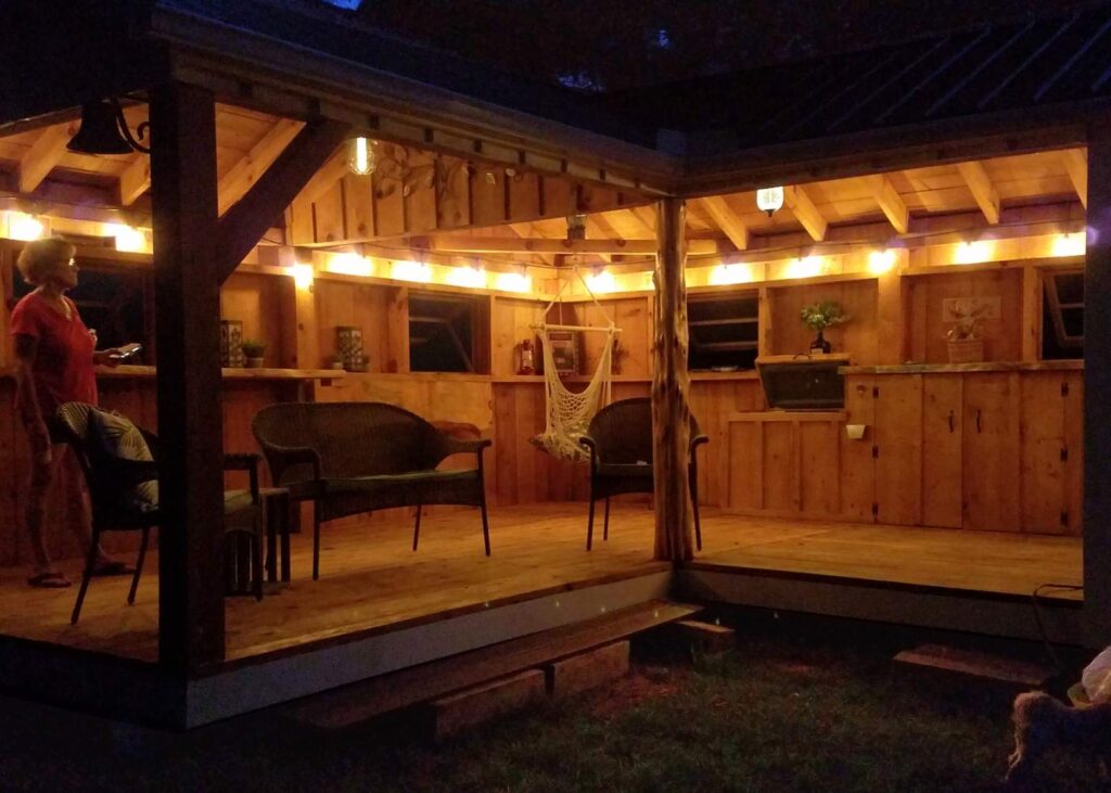 This prefab storage shed was converted into a backyard bar with some creative design choices. 
