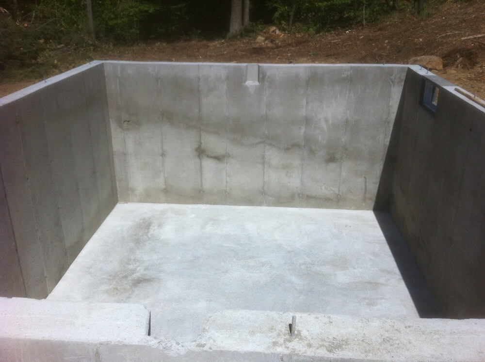 Full concrete foundation with small windows. 