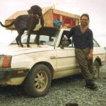 Domenic Mangano - CEO of Jamaica Cottage Shop - travelingn in Alaska with dog