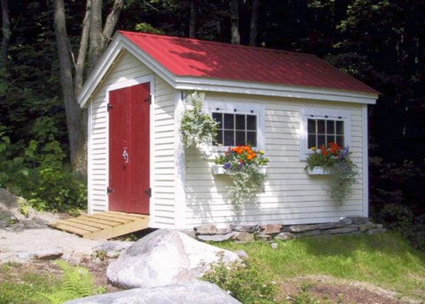 8x12 Gable shed with red roof, clapboard pine siding, red door and flower boxes.