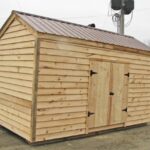 10x14 New Yorker Option A shed with clapboard siding and a brown metal roof