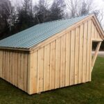 10x14 Camp Alcove with board and batten siding and a metal roof