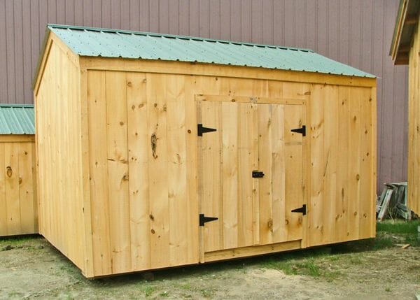 10x14 New Yorker Option A shed includes a set of wide pine double doors with a pressure treated ramp.