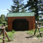 The Standard Run In is a portable horse barn that can be pulled around a pasture