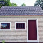 10x16 Harvester post and beam tiny house with asphalt shingle roof and cedar shingle siding