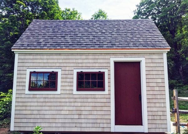 10x16 Hobby House with several personal touches to fit into a quaint New England setting