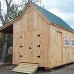 The 10x16 Hobby House includes an overhang for additional storage. A double door with ramp makes rolling equipment in and out a breeze.