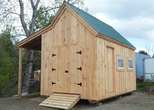 The 10x16 Hobby House includes an overhang for additional storage. A double door with ramp makes rolling equipment in and out a breeze.