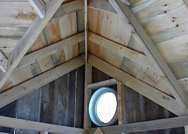 11x16 Bayside cabin interior with solid pine roof sheathing upgrade and insulated round window