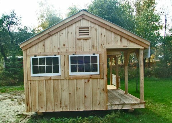 12x20 Gibraltar cottage includes board and batten pine siding, hinged windows, wood louvered vent and and a 4x20 porch.