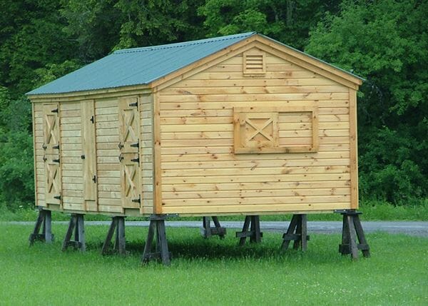 Custom built stall barn with novelty pine siding.