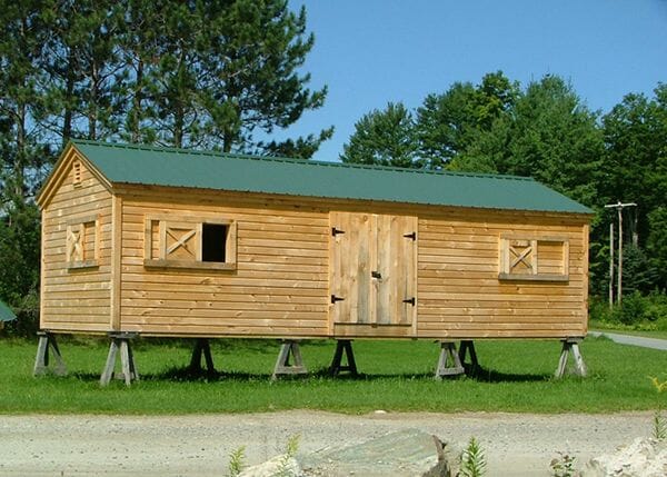 12x16 Gable barn customized with clapboard siding and sliding wooden window openings