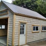 14x20 One Bay Garage with cedar shingle siding, patrician bronze roof and insulated windows