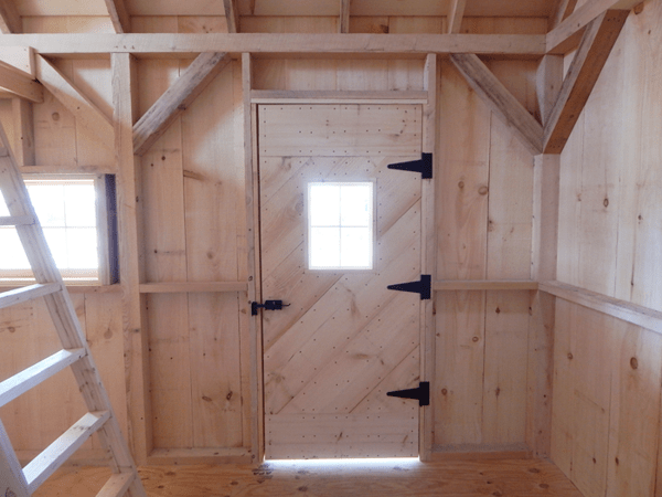 10x16 Harvester with single pine barn door with small fixed window