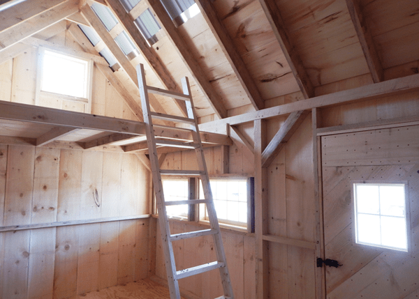 10x16 Harvester cabin includes a sleeping loft. This build includes a custom door