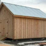 16x20 Barn with pine board and batten siding, double barn doors, pressure treated ramp and a corrugated metal roof (silver galvanized color upgrade)