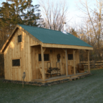 16x20 Vermont Cottage A includes an Evergreen corrugated metal roof and pine board and batten siding