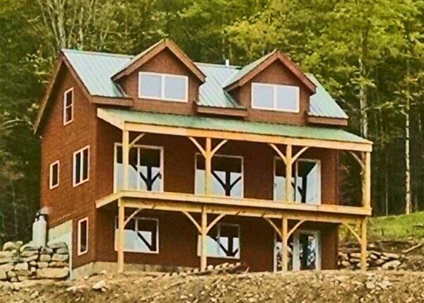 Vermont Cabin with doghouse dormers, overhang, floor system, basement beams and client supplied windows and doors