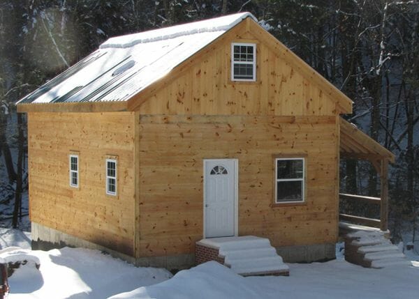 20x30 Vermont Cabin with overhang, installed on a full foundation.