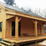 Vermont Cabin with covered porch, floor system and client supplied windows.