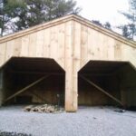 24x24 Simple Garage build in progress with rough sawn hemlock frame and pine board and batten siding