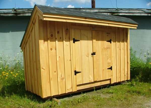 This mini shed works well for storing trash cans and recycling.