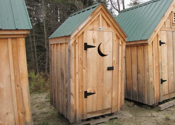 4x4 Outhouse Shed includes an evergreen roof, pine siding and a pine door