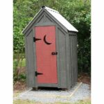 4x4 Outhouse Shed custom built with white metal roof. The siding was painted brown and the door was painted red.