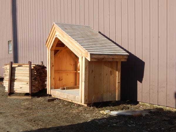 4x8 Hearthstone with a cedar shingle roof with solid pine roof sheathing