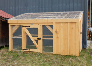 The 5x10 Chicken Coop includes a clearpoly roof, an enclosed side and an open mesh area