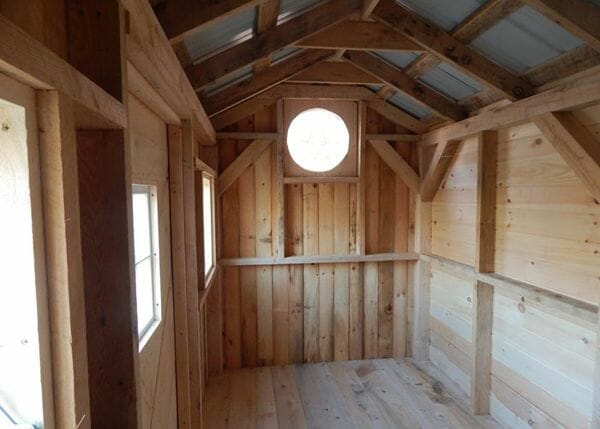 6x12 Nantucket shed interior with glass roundel and extra windows.
