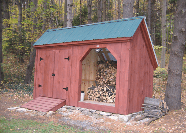 Painted 6x14 Weekender combination firewood storage shed with a set of double doors and PT ramp