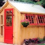 6x8 Greenhouse with antique red door, red hinged windows and other modifications