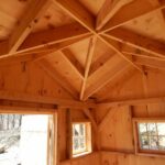 Post and beam Cross Gable Cottage with pine roof sheathing