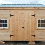 This New Yorker storage shed was customized with the addition of two hinged barn sash windows and horizontal tongue and groove siding