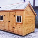 8x12 Church Street is a storage shed that includes two hinged barn sash windows and a set of double doors with a treated ramp