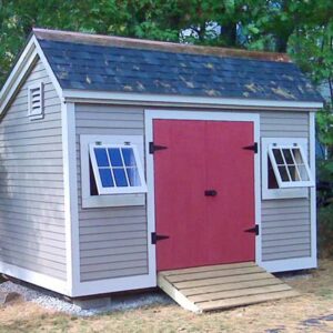 Painted 8x12 Church Street storage shed with red double doors and a pressure treated ramp