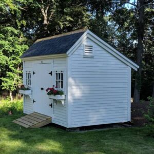 8x12 Church Street storage shed that has been painted white with flower boxes