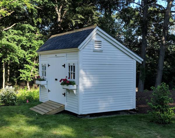 8x12 Church Street storage shed that has been painted white with flower boxes