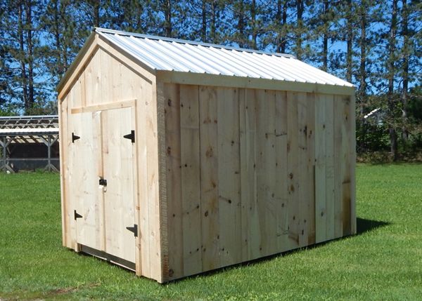 Large basic utility shed with pine board siding