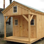 8x16 Bunkhouse includes three windows, pine door, pine board and batten siding, and an evergreen metal roof