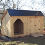 8x16 Weekender firewood storage and shed combo with matte black corrugated metal roof