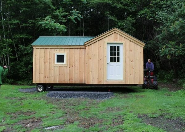 8x18 Heritage converted into a four season cabin with double pane awning window and nine-lite steel door