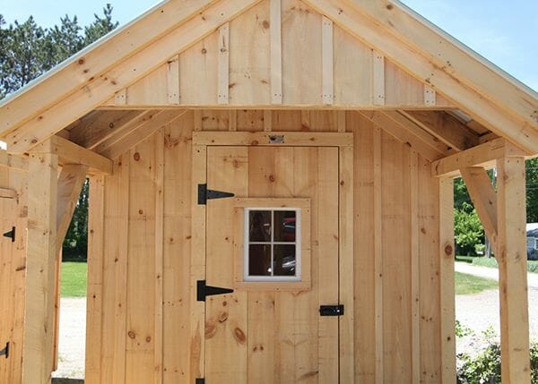 8x12 Garden Shed with single door that has a window installed in it. Door hardware includes three heavy duty steel door hinges and a whitcomb turn latch.