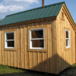 Tiny insulated one-room cabin available as a prefab cottage or pre-cut kit