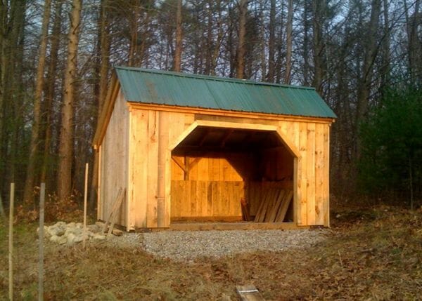 This three sided horse barn can be built prefab or shipped as a pre-cut kit.