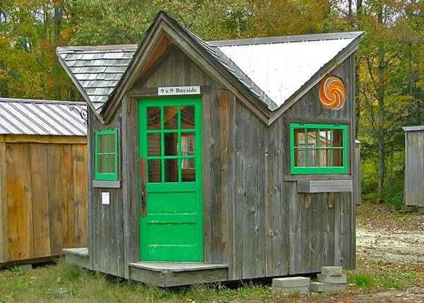 This little post and beam cabin makes a great play house or pool house